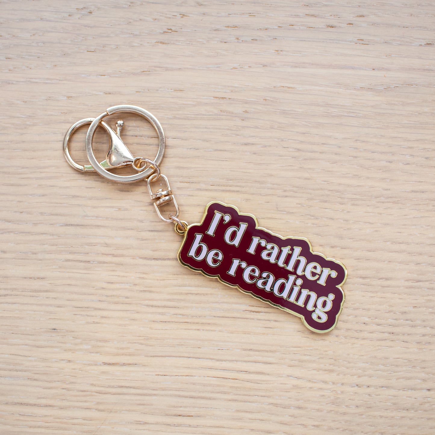 Rather Be Reading Enamel Keychain